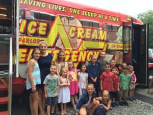 Young Kids in Front of the Ice Cream Emergency Truck